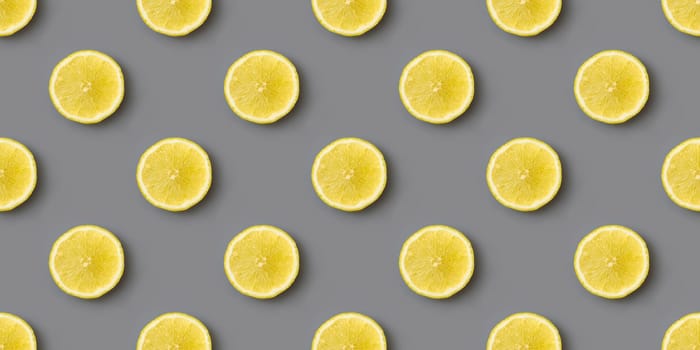 Yellow lemons on gray background seamless endless pattern. Colors of the Year 2021 Illuminating and Ultimate gray. Flat lay