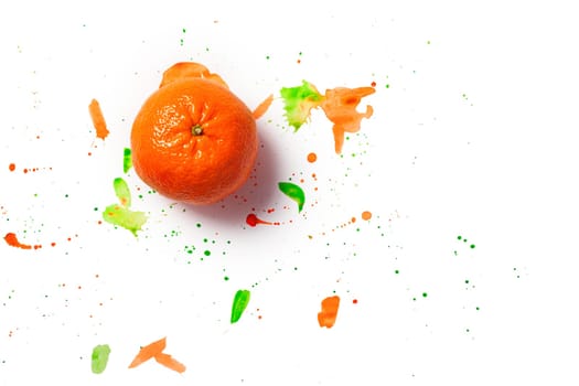 Bright orange tangerine and splashes of orange and green watercolor paint isolated on white background. Flat lay. Copy space