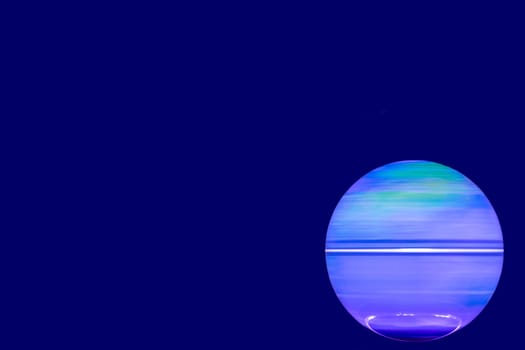 Background Earth shining. A luminous and rotating terrestrial globe or planet earth against dark background with space for design. Beautiful backdrop. Macro.