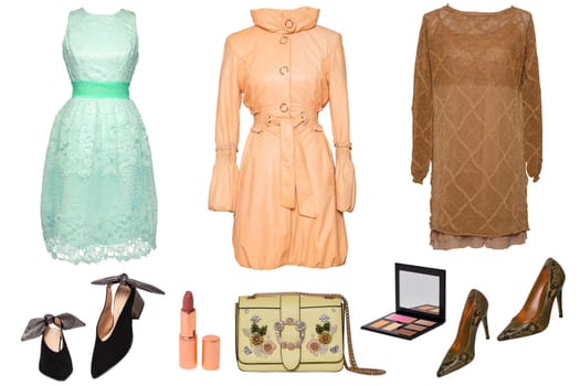 Collage woman clothes. Set of luxurious trendy women coat, dresses, two stylish high heels, handbag, and beauty accessories isolated on a white. Latest fashion trends.