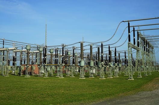 Electric power station under blue sky in summer