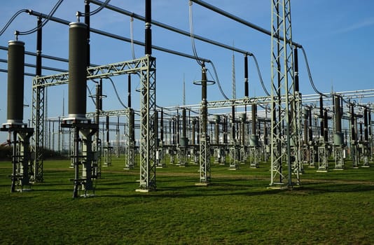 Electric power station under blue sky in summer