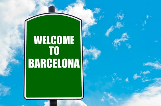 Green road sign with greeting message WELCOME TO BARCELONA isolated over clear blue sky background with available copy space. Travel destination concept  image