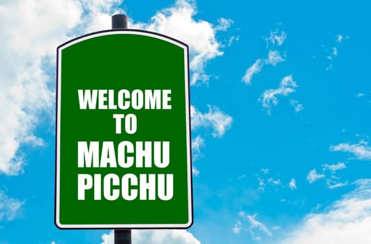 Green road sign with greeting message WELCOME TO MACHU PICCHU, PERU isolated over clear blue sky background with available copy space. Travel destination concept  image