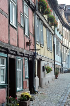 historic alley with old half-timbered houses in the old town of Quedlinburg