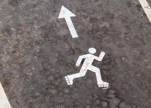 Shot of the paint marking on the asphalt indicating roller skating path