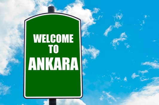 Green road sign with greeting message WELCOME TO ANKARA, TURKEY isolated over clear blue sky background with available copy space. Travel destination concept  image