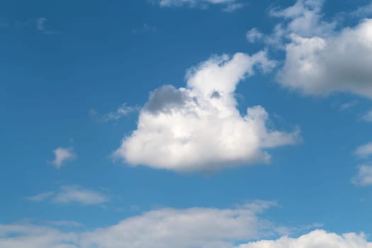 Beautiful white clouds photographed closeup against blue sky