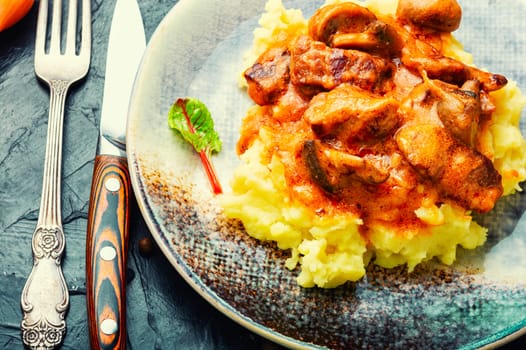 Beef meat stew in sauce with mashed potatoes. Space for text, recipe place