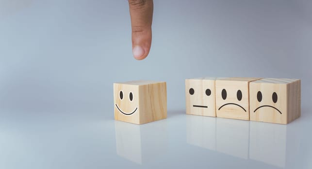 Hand choosing happy smile icon. represents feedback rating and positive customer review, Satisfaction Concept, satisfaction survey ,mental health assessment, world mental health day, think positive concept