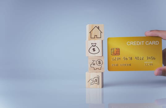 Concept of selling a house. A hand is holding credit card on a white background. Real estate agent offer house, property insurance and security, affordable housing concepts, home insurance broker agent, salesman person.