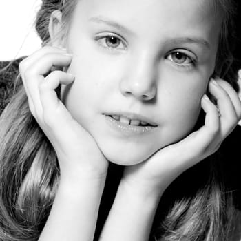 Studio portrait of a blond child in a duo-tone edit