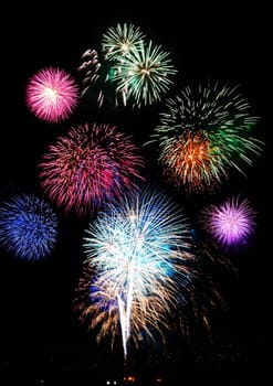 Fireworks lighting up a dark sky.