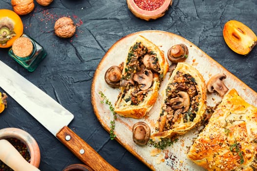 Closed homemade savory tart pie with mushrooms