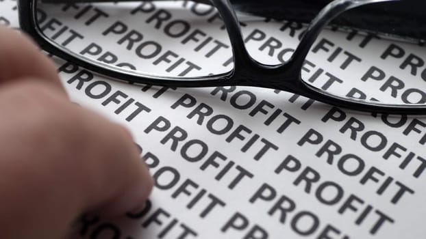 Finger tapping on profit text