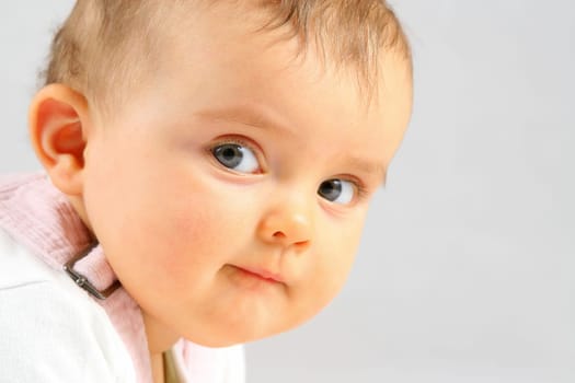 nice small baby girl looking at the camera