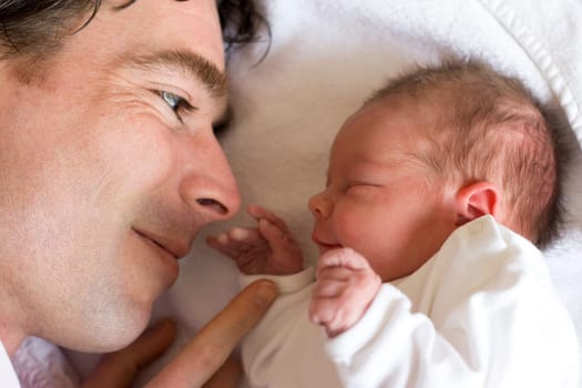 young father with his newborn daughter, only a couple of hours old