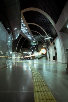 Vertical shot of a light resembling will-o'-the-wisp in a subway station in Cologne, Germany