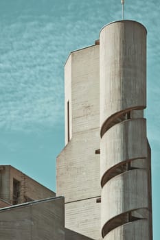 Christi Auferstehung church tower with spiral staircase on blue sky background in Cologne, Germany