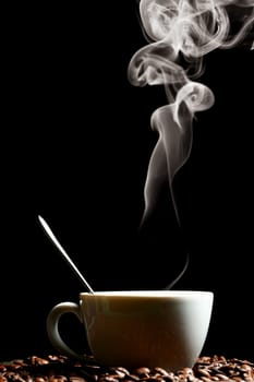 coffee beans and white hot cup of drink