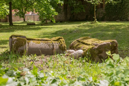 Two overturned columns on a churchyard
