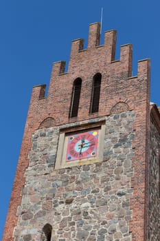 Tower of a church with a large dial