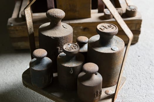 Old,rusted weights on a scale