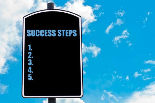 SUCCESS STEPS motivational quote written on road sign isolated over clear blue sky background with available copy space. Concept  image