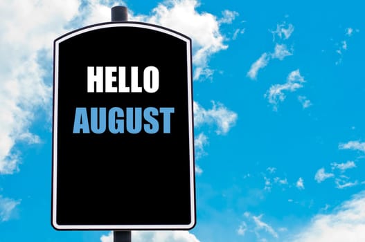 HELLO AUGUST motivational quote written on road sign isolated over clear blue sky background with available copy space. Concept  image