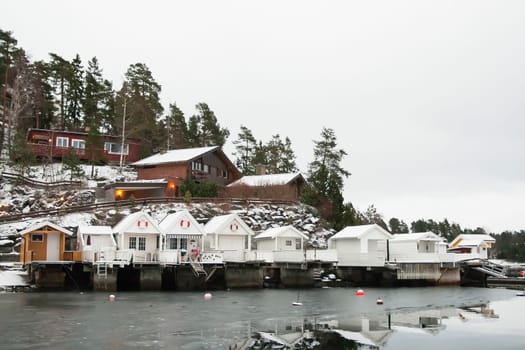 View at sunrise of a bathhouse norvegian snow