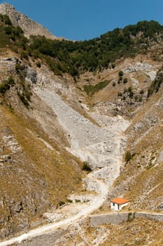 Mountain gorge with old road to the manual transport of marble