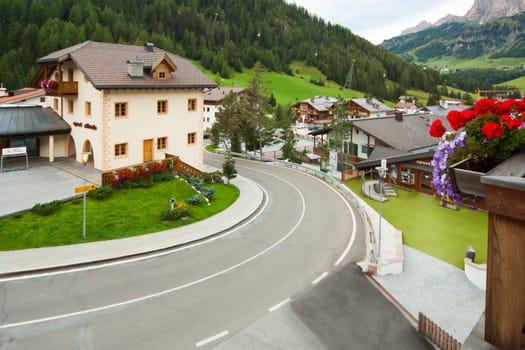 Winding road through the mountain village of Corvara