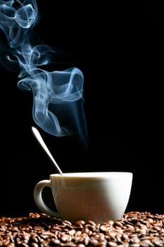 coffee beans and white hot cup of drink