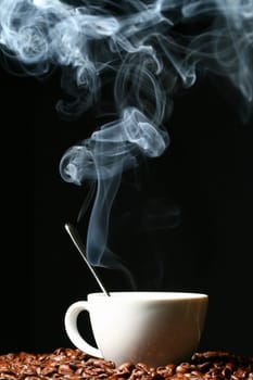 coffee beans and white hot cup of drink