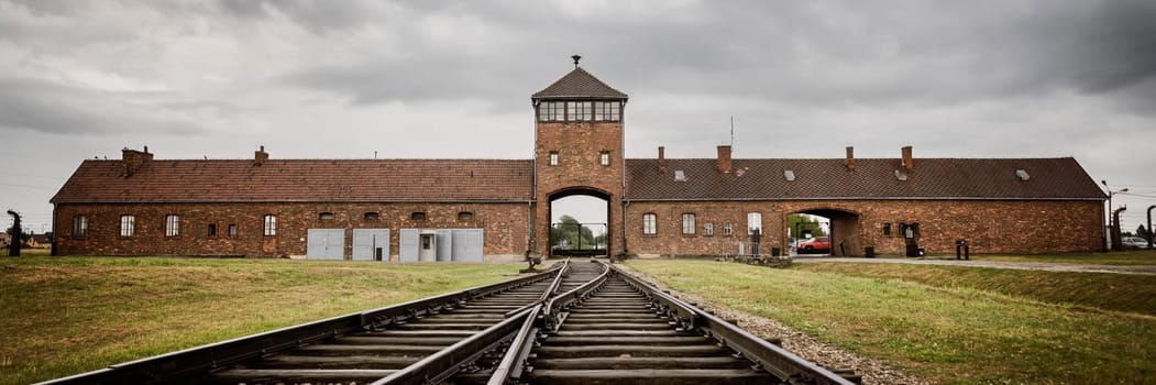 Railroad track to main gate of Auschwitz former German concentration and extermination camp in Poland