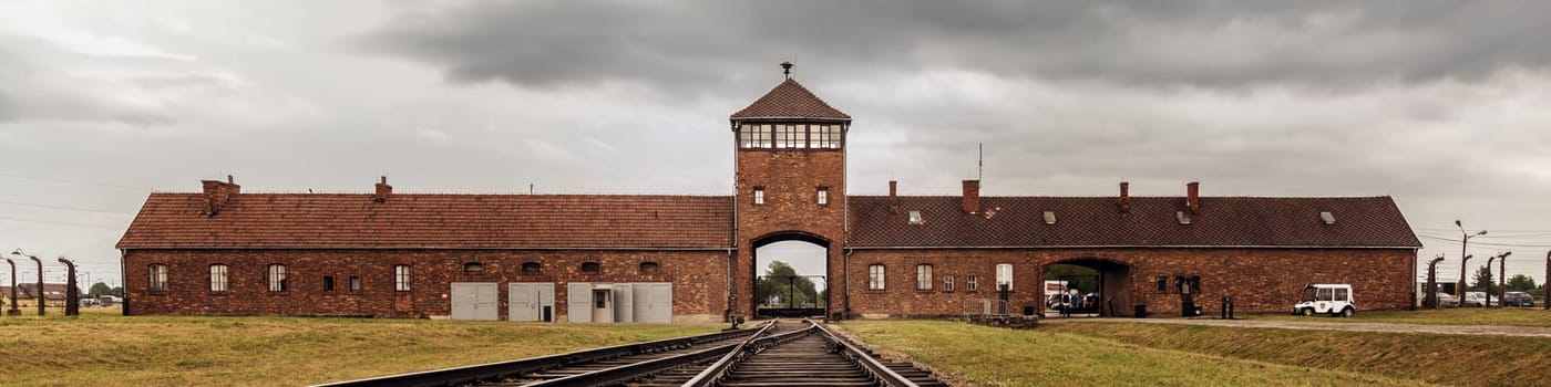 Railroad track to main gate of Auschwitz former German concentration and extermination camp in Poland