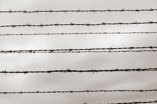 Barbed wire fence in Auschwitz Nazi concentration and extermination camp in Poland