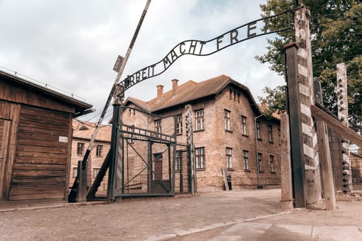 Entrance gate to former German Nazi concentration and extermination camp in Auschwitz in Poland