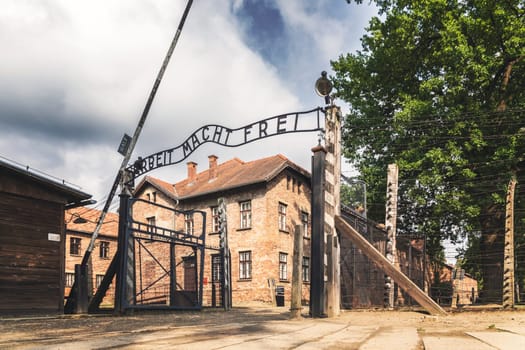 Entrance gate to former German Nazi concentration and extermination camp in Auschwitz in Poland