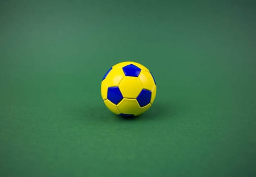 Soccer ball on the green lawn of the field. Football field. Football tournament. Soccer ball. Sports team game. Sport equipment. Healthy lifestyle. Background image.