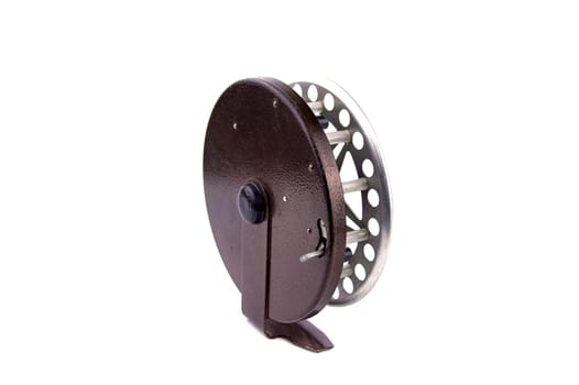 Old aluminum reel for fishing spinning line. Spinning reel. Fisherman's equipment. White background.