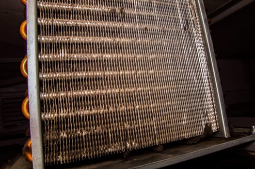 Aluminum grid for the copper condenser of the refrigeration unit. Refrigerator repair. Refrigeration piping. Cooling radiator. Service maintenance. Repair of air conditioners. Industry.