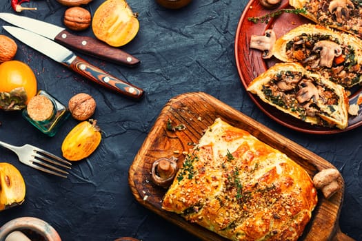 Baked closed mushroom pie, sliced mushroom champignons tart. Wellington pie