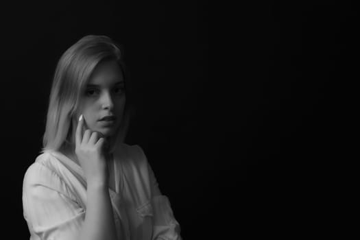 Black and white portrait of sad .girl. Horizontally.