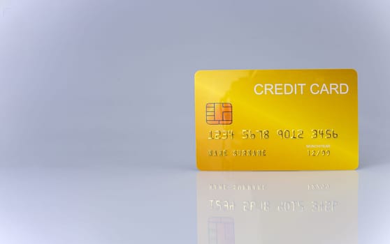 Hand holding credit card isolated on white background. Shopping concept. Cashless spending concept.