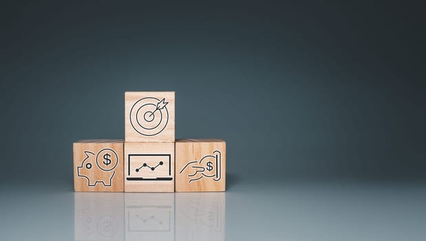 Wood cube block stacking with icon.Concept of business strategy and goal action plan.