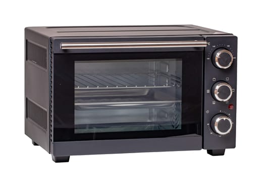 Kitchen electrical appliances. Close-up of a small electric oven isolated on a white background. Clipping path. Macro.