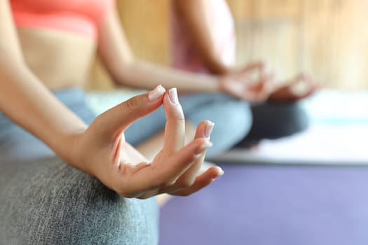 Close op of a hand of a woman doing yoga in spa