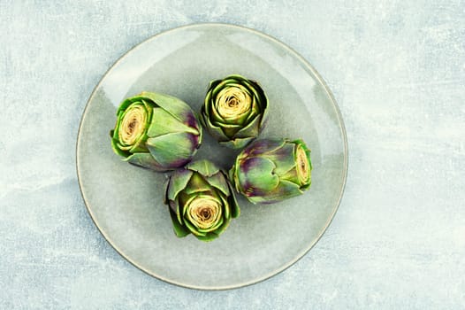 Unopened raw artichoke buds, food. Italian cuisine