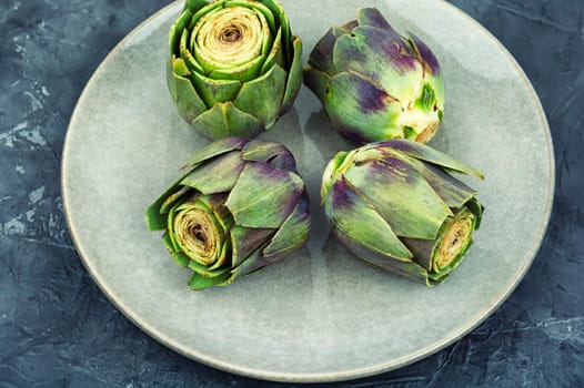 Unopened raw artichoke buds, food. Italian cuisine